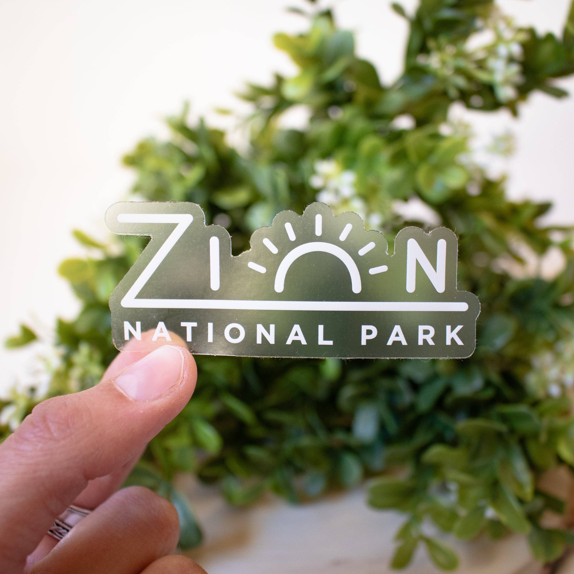 Zion National Park is one of my favorite places to visit and so full of adventure. This Zion sticker is printed on a clear sticker with a white print so it looks amazing on any water bottle, except maybe a white one.
Size: 3" x 1.25"
All of our stickers a