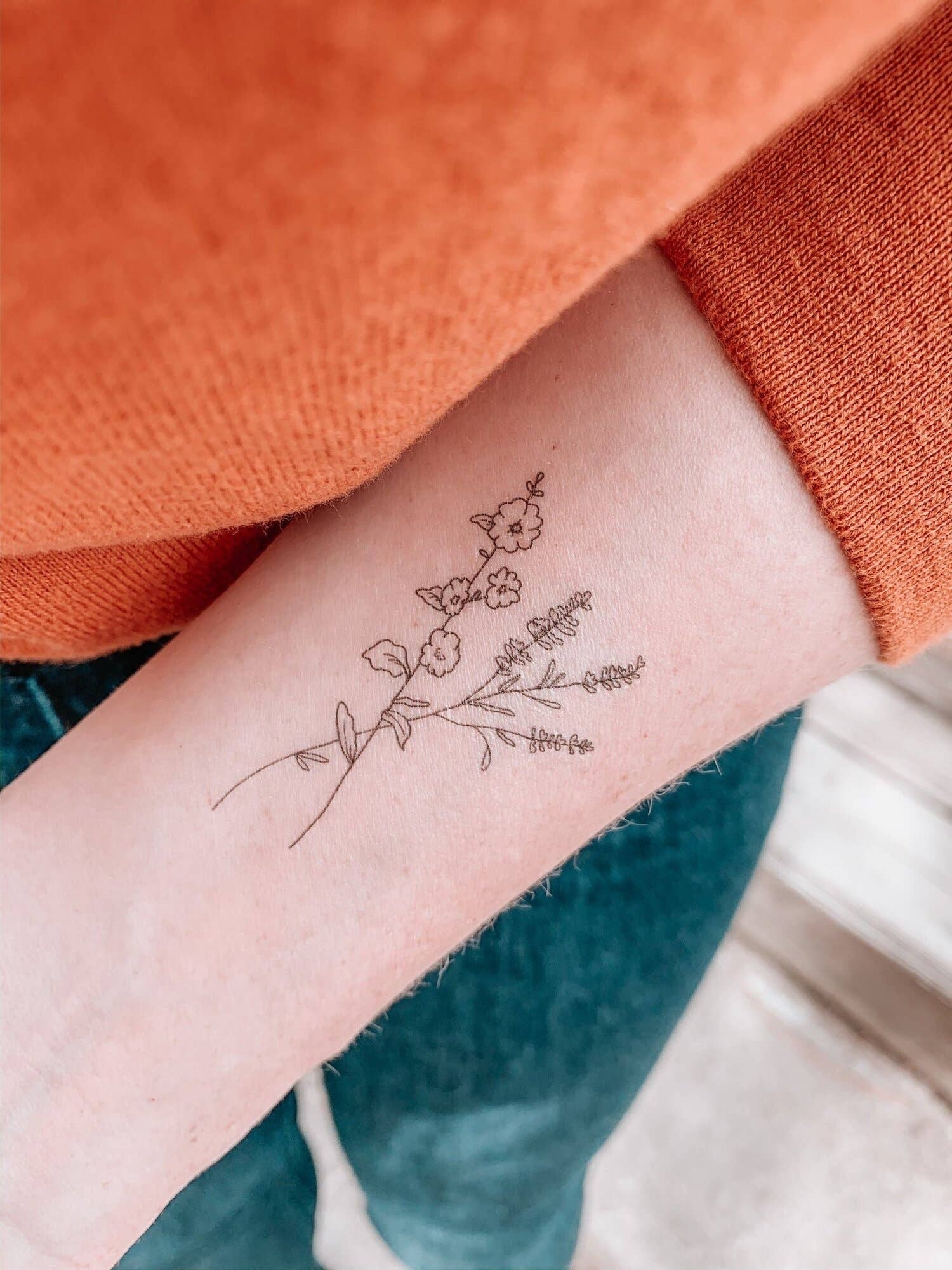 Featuring thoughtfully hand drawn wildflowers, this temporary tattoo reminds us to bloom wherever life may plant us. This temporary tattoo makes a thoughtful small gift or a pain-free way to try out a tattoo!
DETAILS:
Set of two temporary tattoos
Dimens