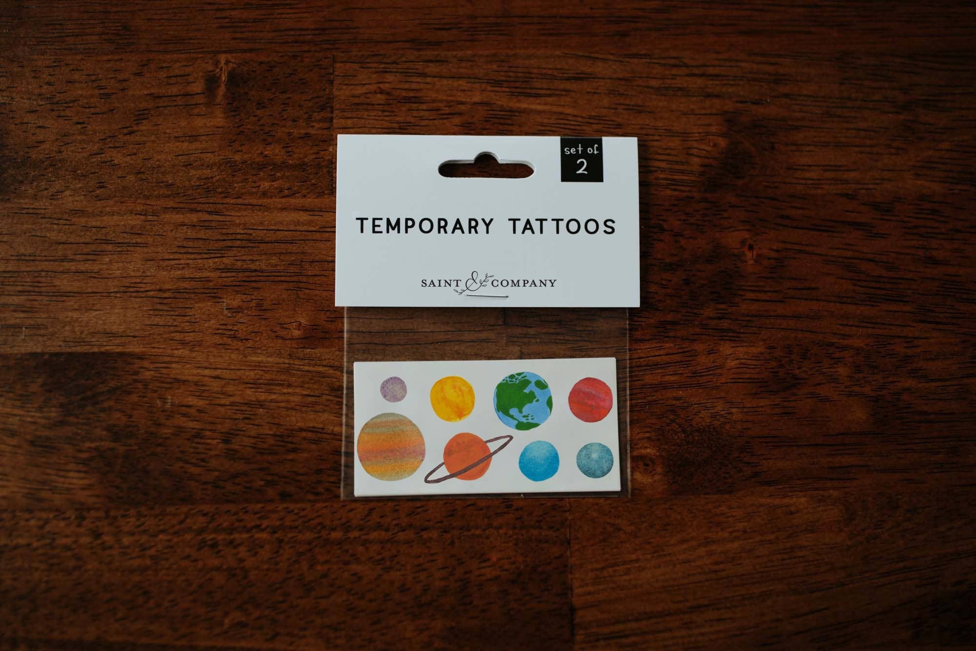 Can you name all eight planets?! Cut this sheet apart to create your own solar system! Includes Mercury, Venus, Earth, Mars, Jupiter, Saturn, Uranus + Neptune.
Set of 2 temporary tattoos
Size of sheet: 3 inch x 1.5 inch
Application Directions: Place th