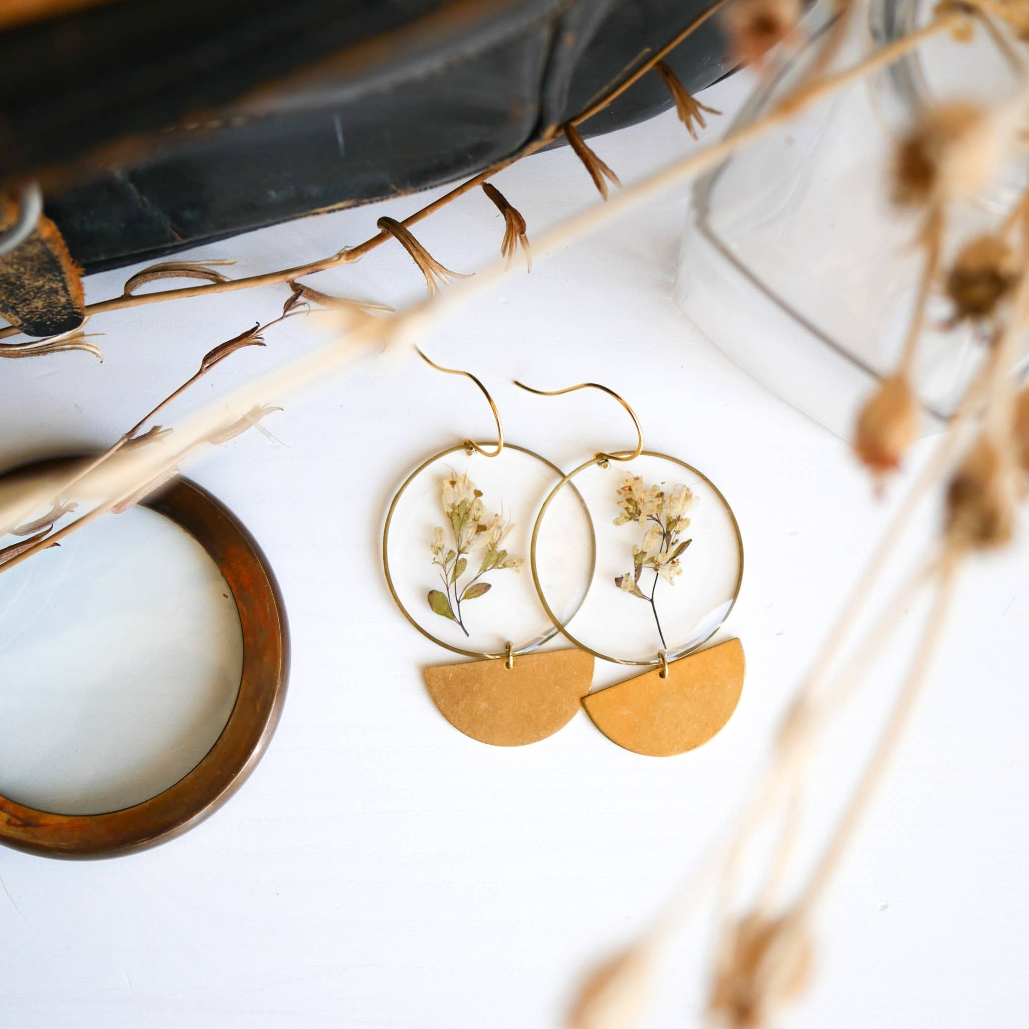 Our best selling Phase Earrings finished with the Meadow Collection Botanicals. These earrings are big and bold but super lightweight, making them the perfect statement earring for all day wear. The monochromatic look makes them easy to wear with any outf