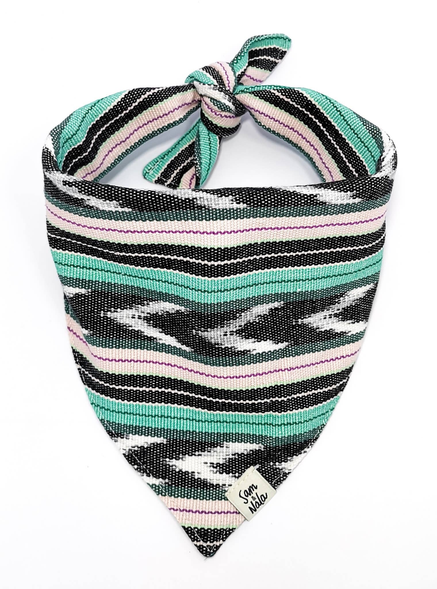 This vibrant and invigorating fabric gives off a movement as quick and fluttering as a tropical fish. Giving you that same sense of intrigue and absence of sound when first walking into an aquarium. Machine Washable Dog Bandana
This fabric was hand-wove
