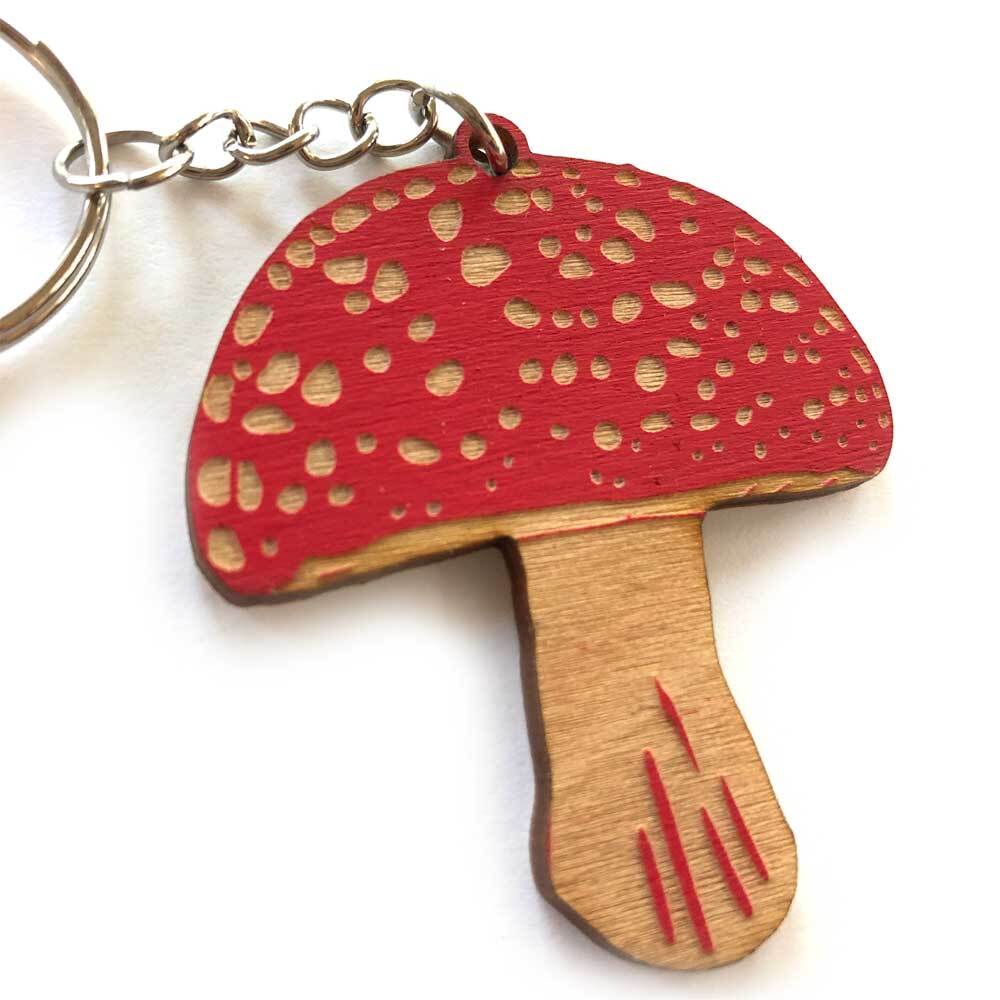Our bestselling mushrooms–in keychain form!
Available in:
• Amanita (red) 2" x 2.25"
• Morel (natural) 1" x 2.5"
• Chanterelle (orange) 2" x 2.5"
Each keychain is made of handpainted laser-engraved baltic birch plywood and secured with a metal keyring