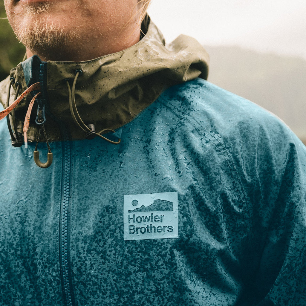 Howler Bros- Storm Splitter Rain Shell: Dark Teal/ Dark Olive