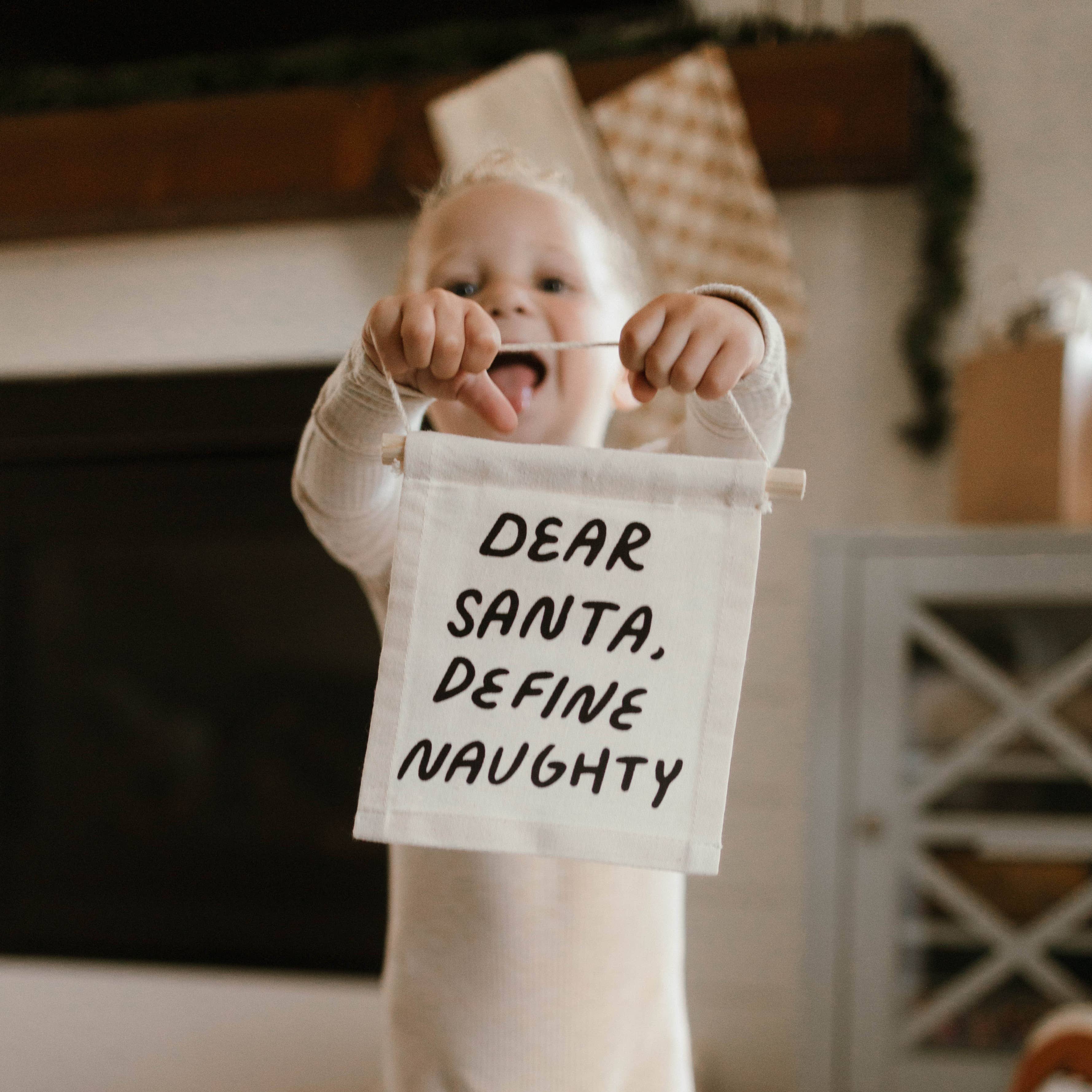 Imani Collective- Dear santa, define naughty hang sign