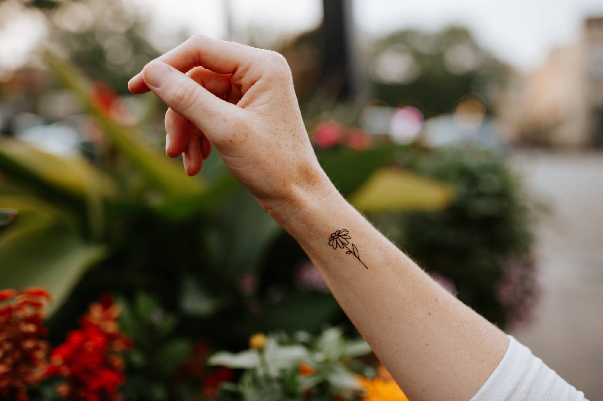 Featuring a thoughtfully hand drawn eucalyptus branch, a small daisy, and a little mountain range - easily cut this tattoo sheet into 3 separate tattoos, or apply all at once for one big tattoo!

DETAILS:
Set of two temporary tattoos
Dimensions of the she