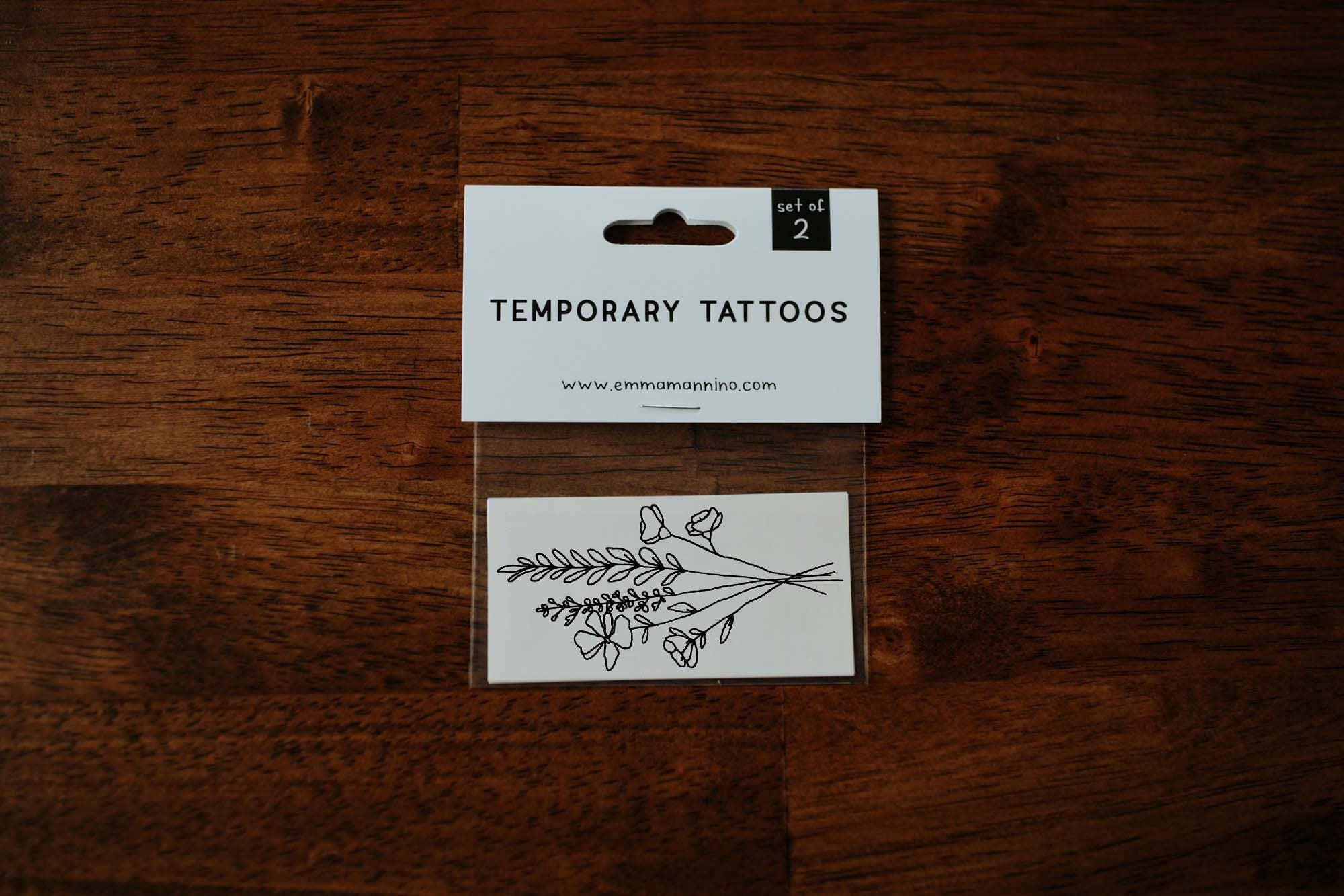 Have you ever hiked alongside a mountain and overlooked a meadow of beautiful wildflowers? This simple hand drawn bouquet commemorates those radiant wild blooms, and reminds us of living wild and free.

Set of 2 temporary tattoos

Size of sheet: 3 inch x 