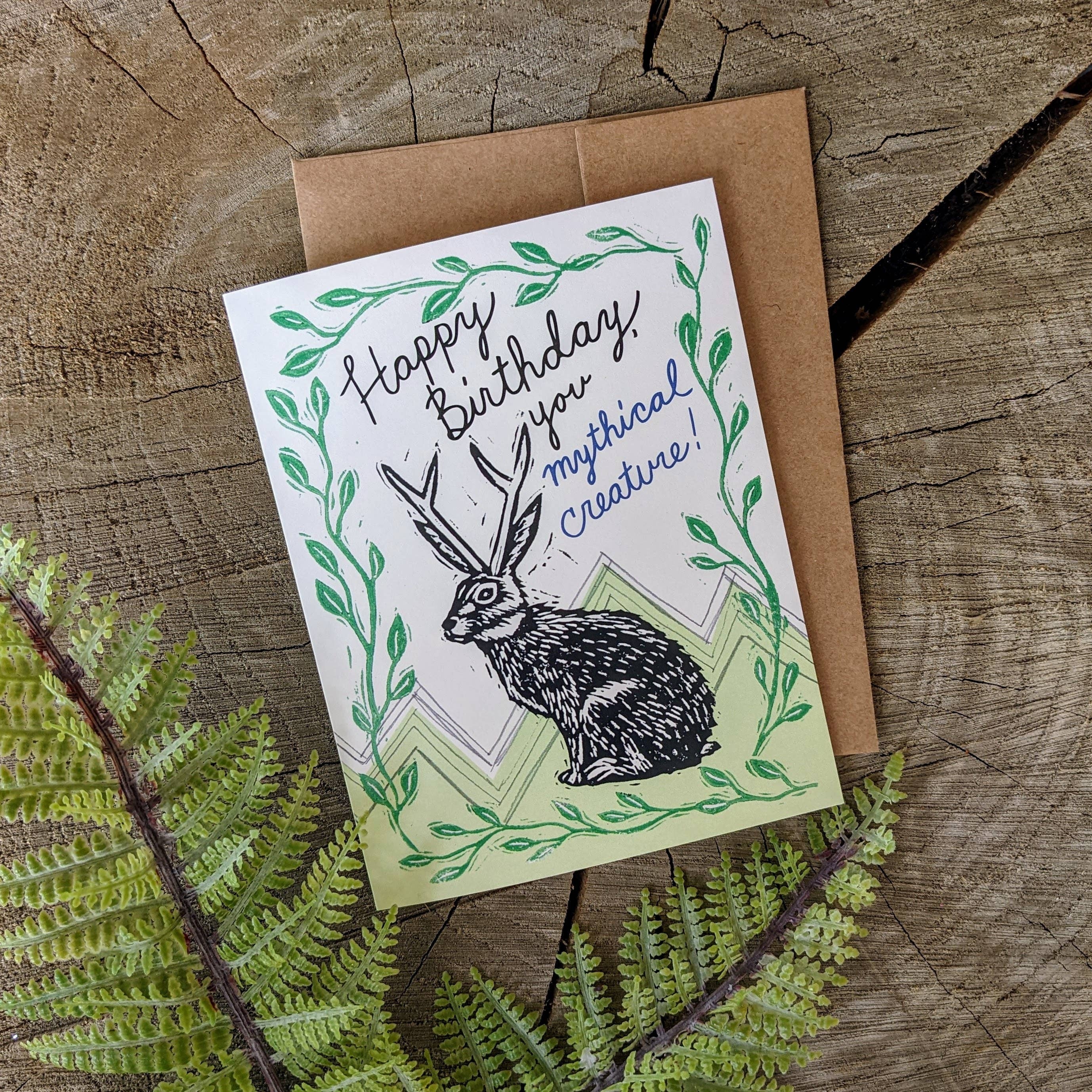 happy birthday, you mythical creature
A mythical jackalope sends his happy birthday greeting. Reproduced from one of ilikesara's linocut prints.

-card measures 4.25" x 5.5" when folded
-printed on 100 lb off-white cover paper
-includes kraft envelope
-bl