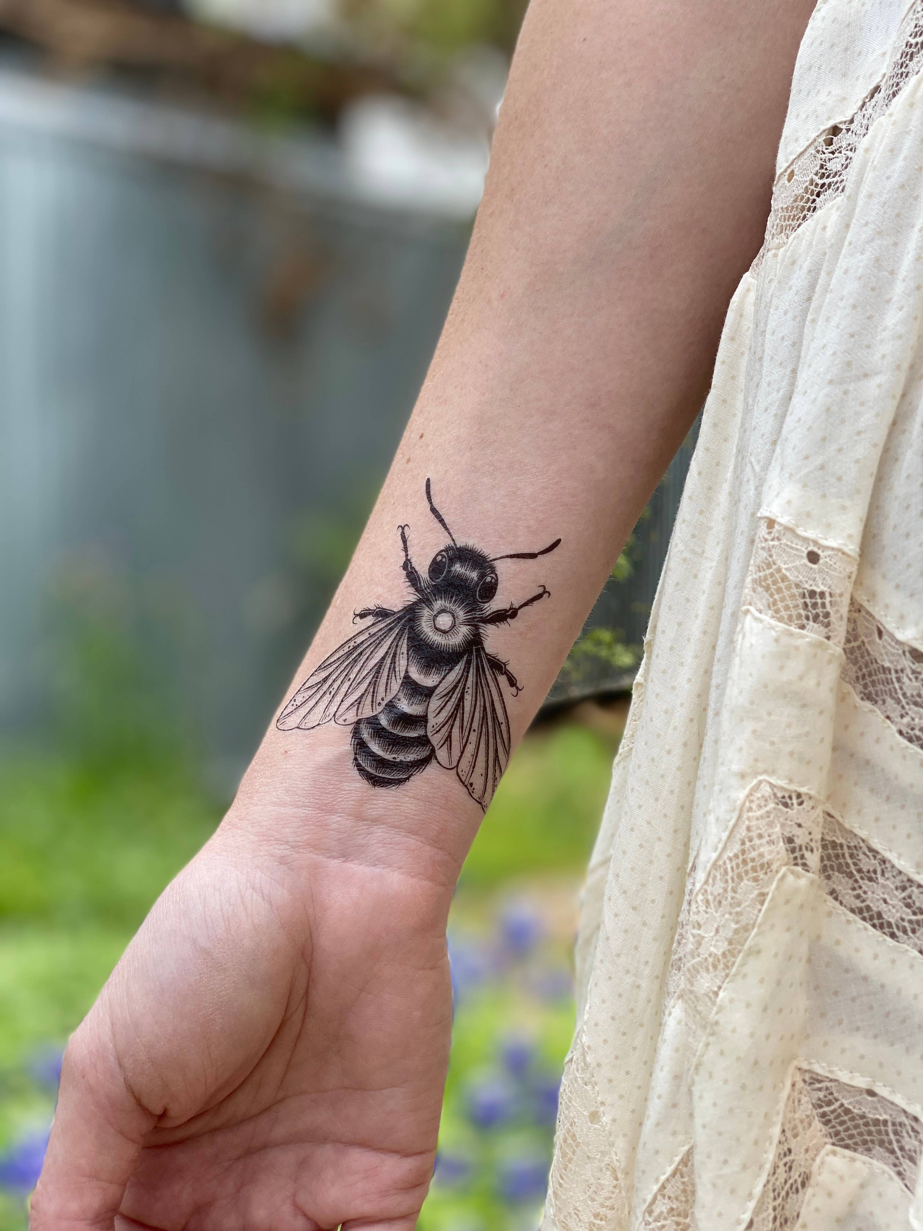 Big bee temporary tattoo 2 pack. Hand-drawn in black lines. This familiar pollinator and beloved insect represents spring and productivity to many people. What does the bee represent to you?

Whole sheet measures 3 by 4 inches.

All tats now come in 2 Pac