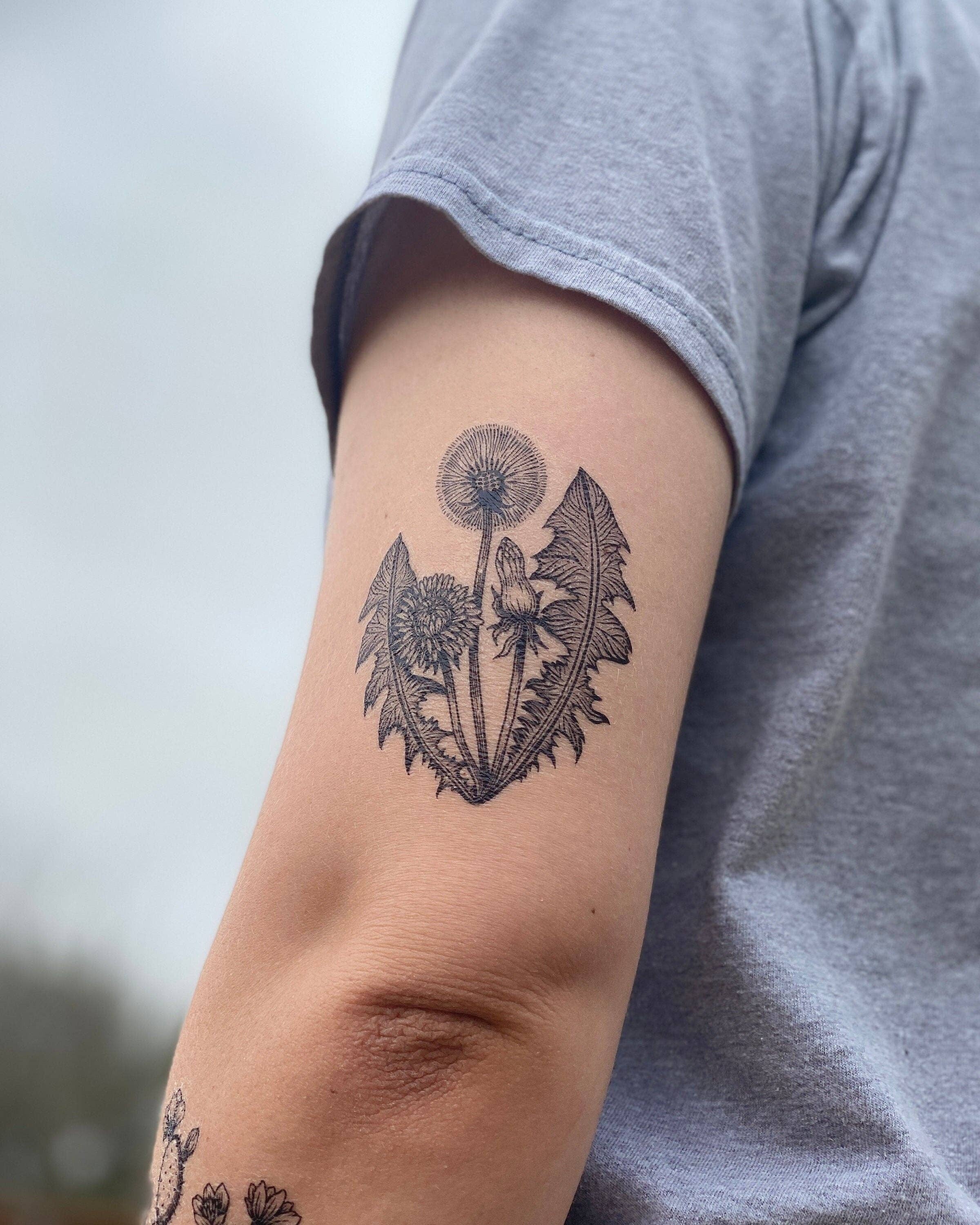 Dandelion temporary tattoo 2 pack! This blooming dandelion plant design measures 2.5x3.5 inches with black lines and shading.

Dandelions are both marvelous and misunderstood plants, often seen as a weed to some and a wonder to others. This well-known gar