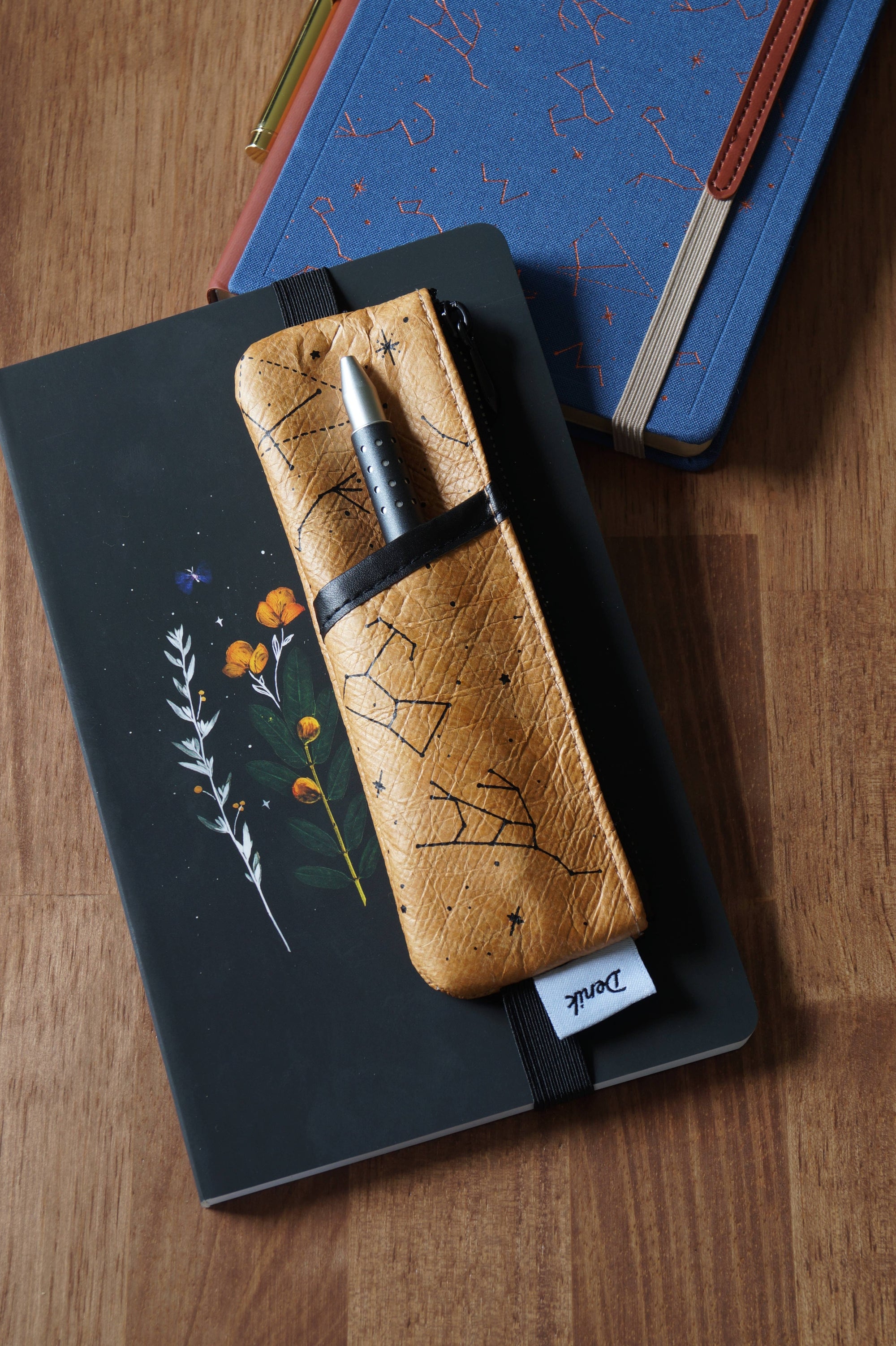 Keep your favorite notebooks and writing accessories together forever with our new notebook pouches. (Seriously, we're not sure why we didn't think of these sooner.) Cool textured body with bestselling constellation art, fully lined with an elastic band t