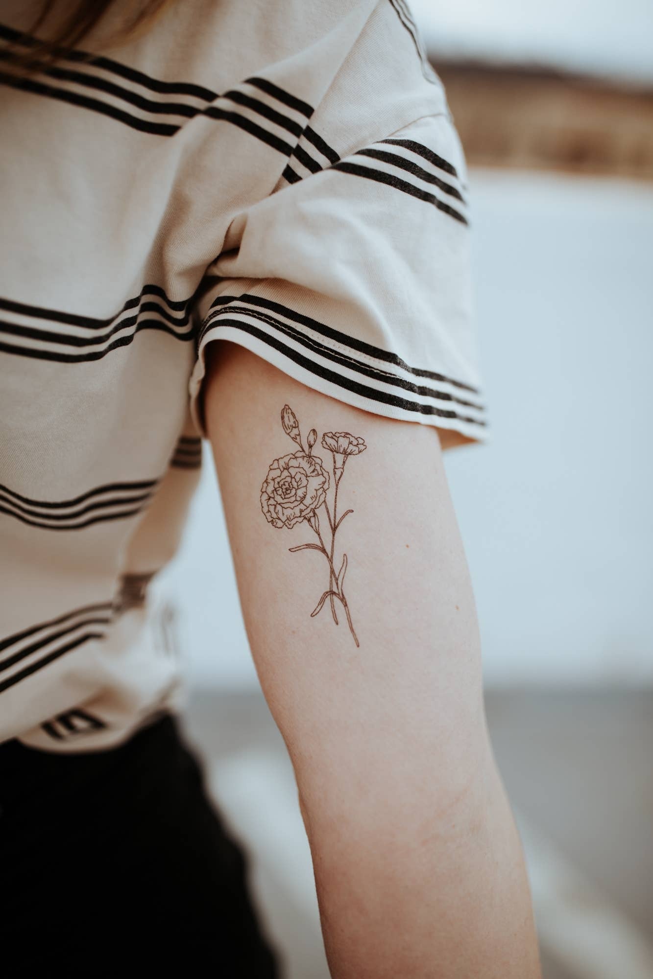 BIRTH FLOWER COLLECTION

CARNATION is the birth flower for JANUARY

Set of 2 temporary tattoos.

Approximate size of tattoo: 3 inch x 1.5 inch

Application Directions: Place the tattoo face down on skin. Apply even pressure to the tattoo paper backing usi