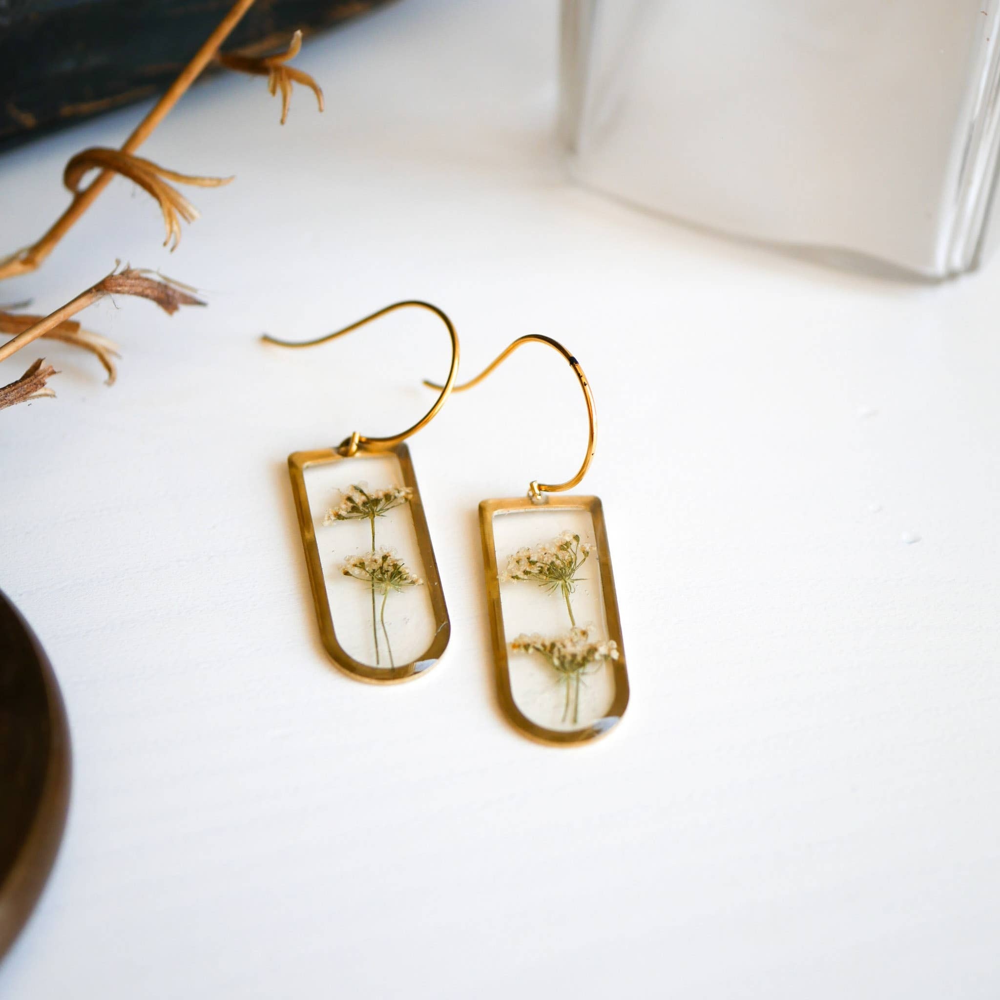 Our best selling Cathedral Earrings finished with the Meadow Collection Botanicals. These delicate dangles earrings have the sweetest nostalgic charm. The monochromatic look makes them easy to wear with any outfit!

The Meadow is know to symbolize growth,