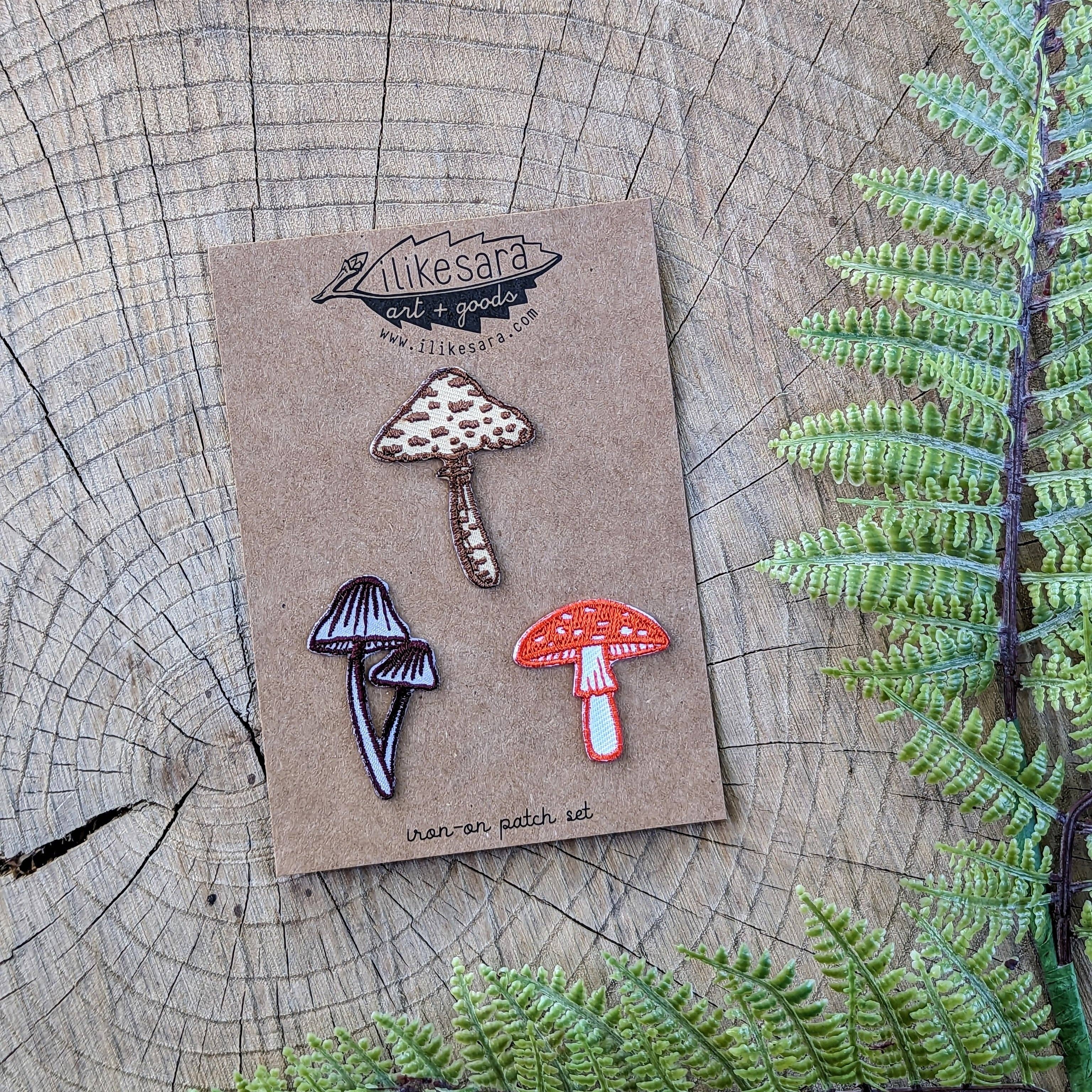 3 mushroom patches to adorn wherever you need another fungi friend (or 3)! Featuring pixie caps, parasol, and fly agaric mushrooms. Based on illustrations by ilikesara / Sara Schalliol-Hodge.

Most things are made better with the addition of a small fungu