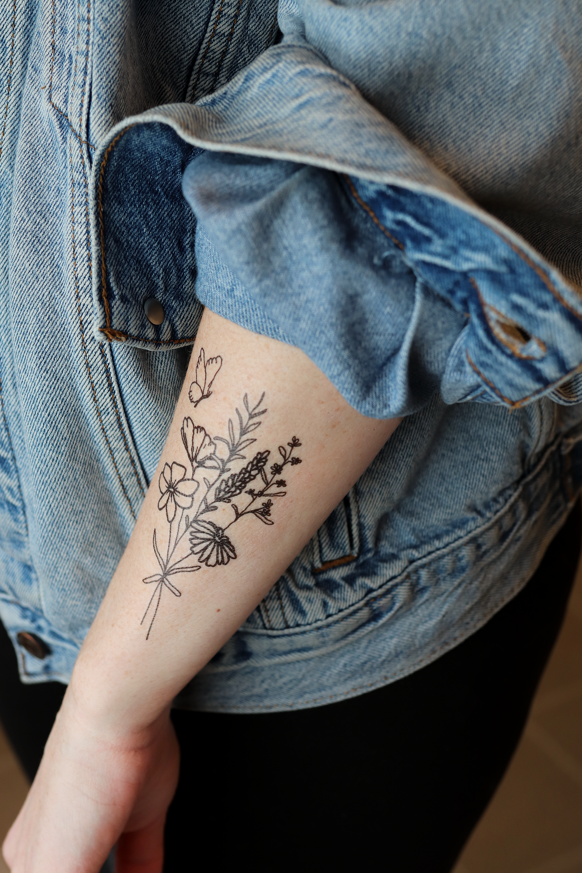Featuring an originally hand-drawn bouquet of delicate flowers with a butterfly, this temporary tattoo makes a thoughtful small gift or a pain-free way to try out a tattoo!

DETAILS:
Set of two temporary tattoos
Dimensions: 2.5" x 4.5"
Safe, non-toxic, an