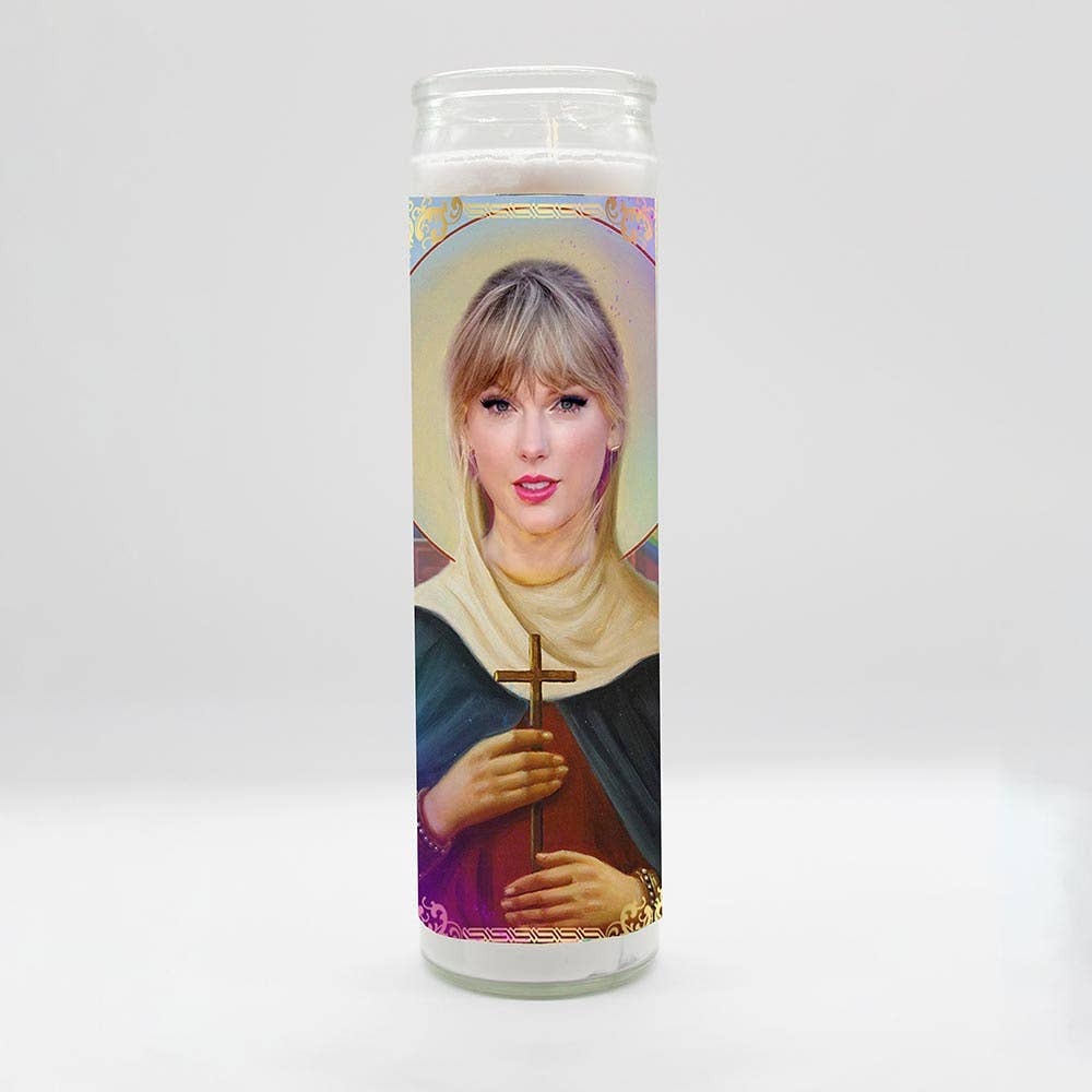 Tall white candle, hand poured in Mexico, design and assembled in the USA. Candle is unscented. Taylor Swift inspired parody art prayer candle.
