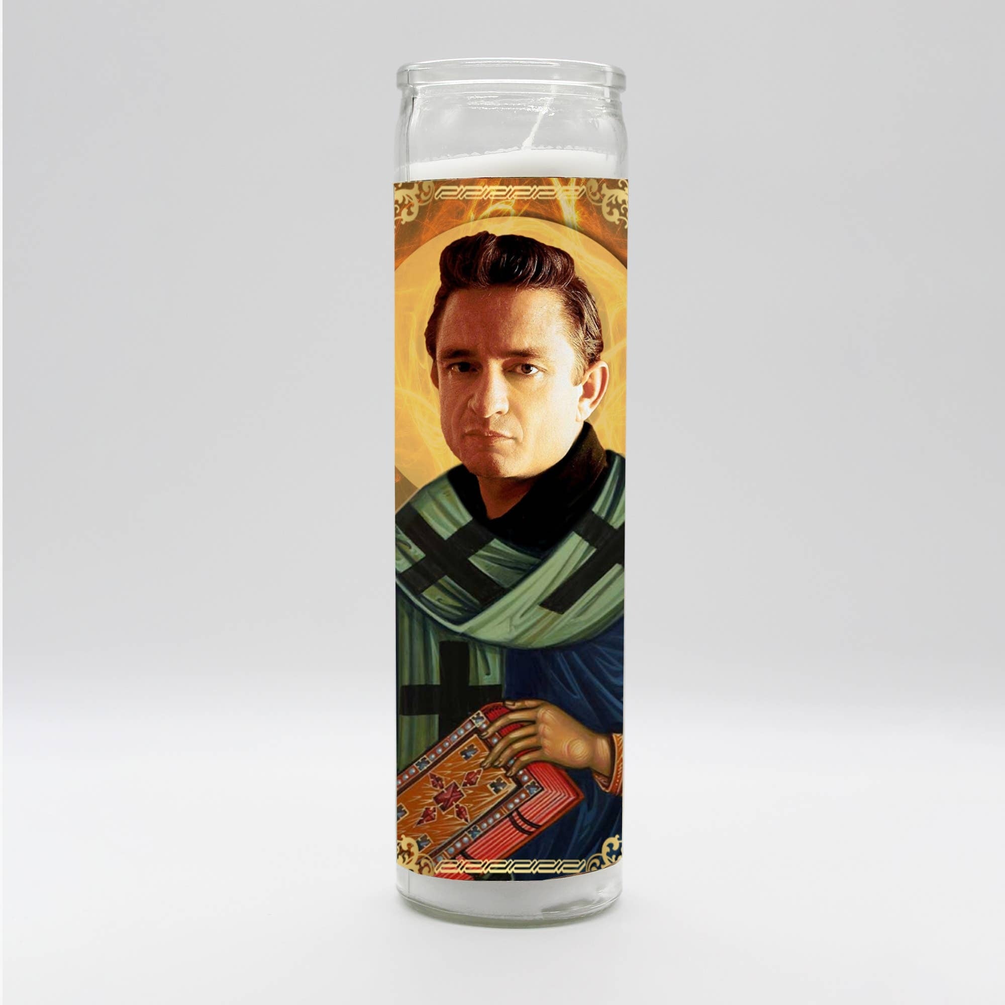 Tall white candle, hand poured in Mexico, design and assembled in the USA. Candle is unscented. Johnny Cash inspired parody art prayer candle.