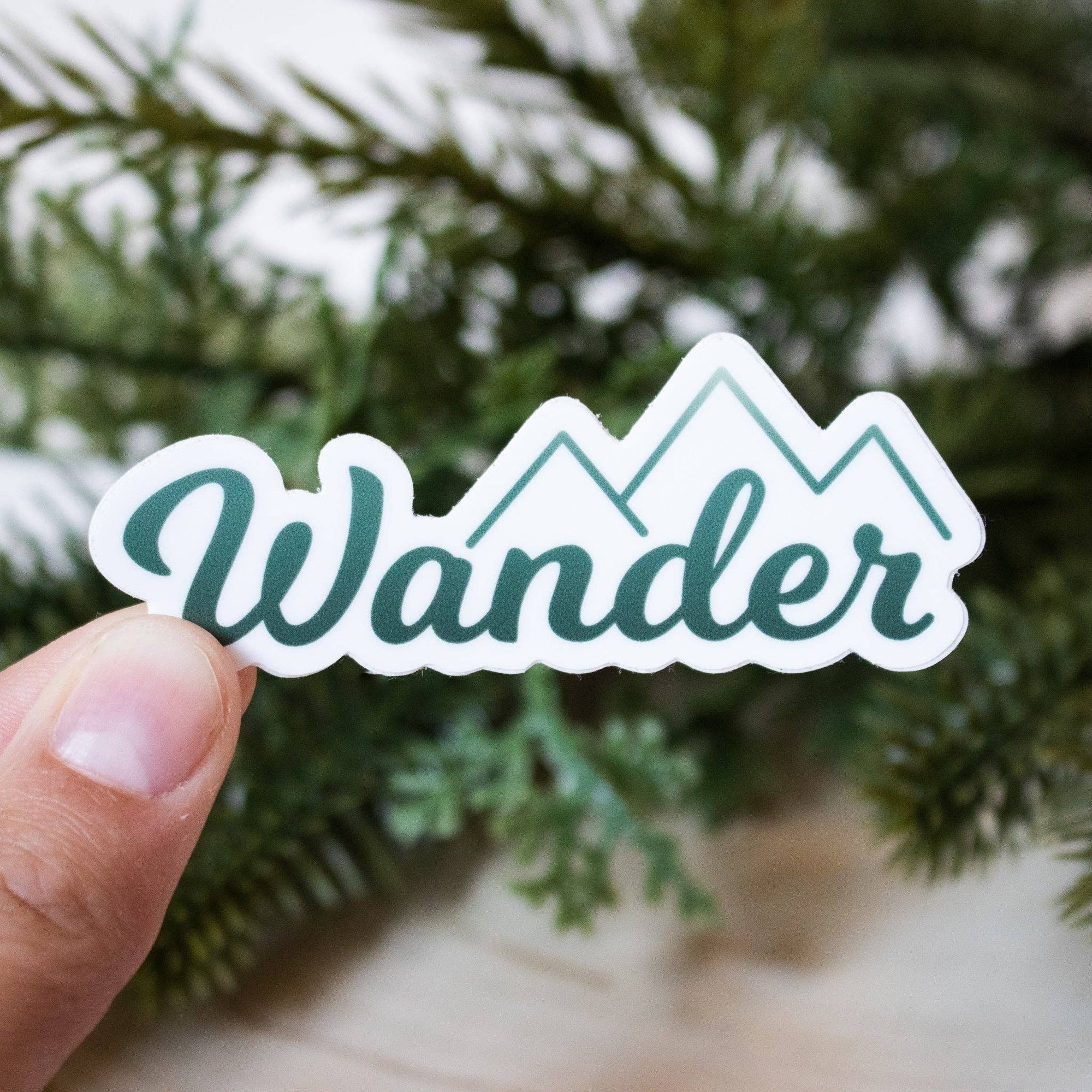 A sticker for all those who wander. I don't know about you but I suffer from some serious wanderlust. This sticker is inspired by my wanderlust and desire to be outside.

Size: 3" x 1.25"

All of our stickers are made using waterproof, weatherproof, and d