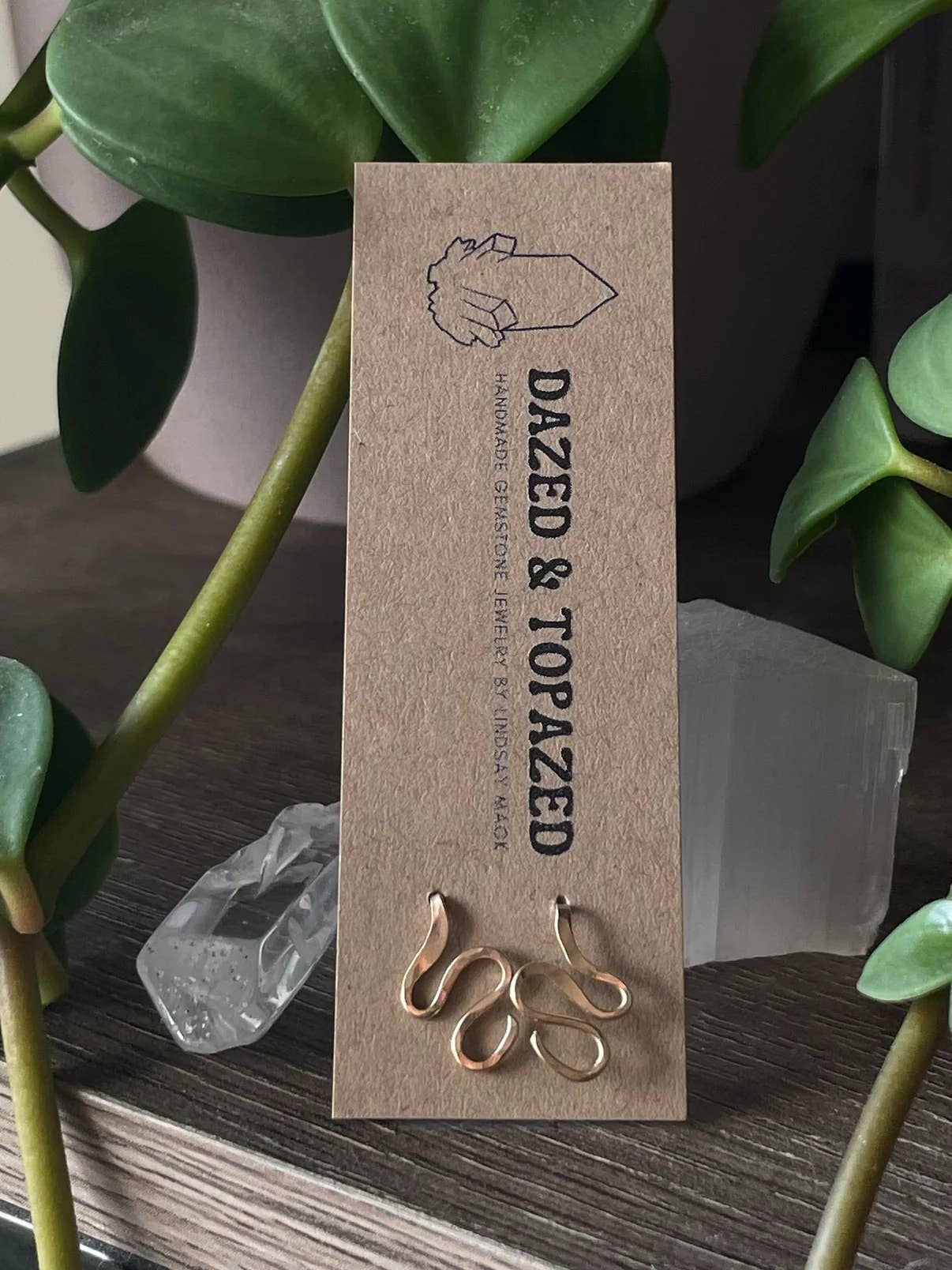 Lucky Snake earrings are made with 14k gold filled and are meant to wear alongside your ear. Once in position, gently squeeze to back of the ear.